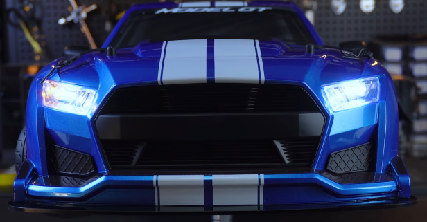 Model GT with its headlights illuminated