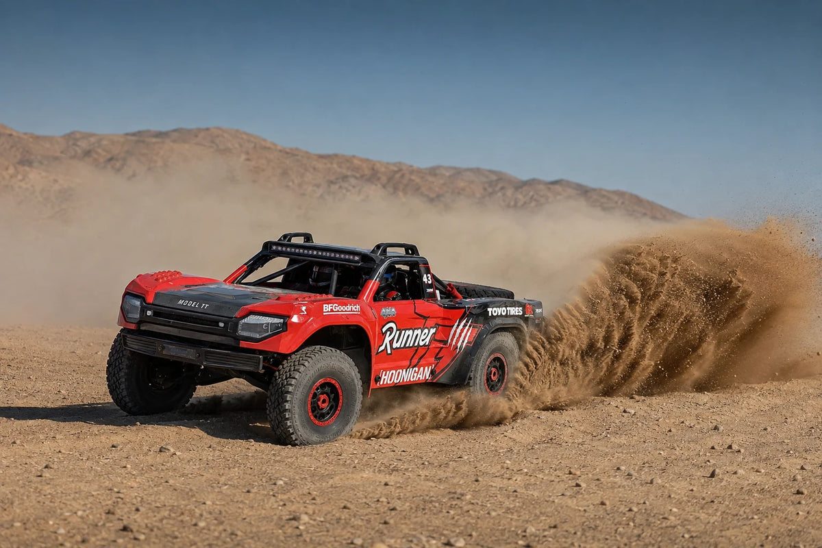 Red Model TT on a sandy off-road trail